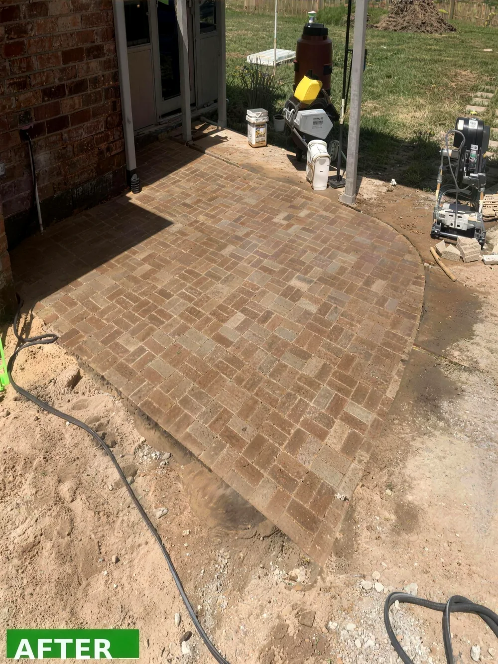 Finished paver patio hardscape installation by Mahalic and Sons