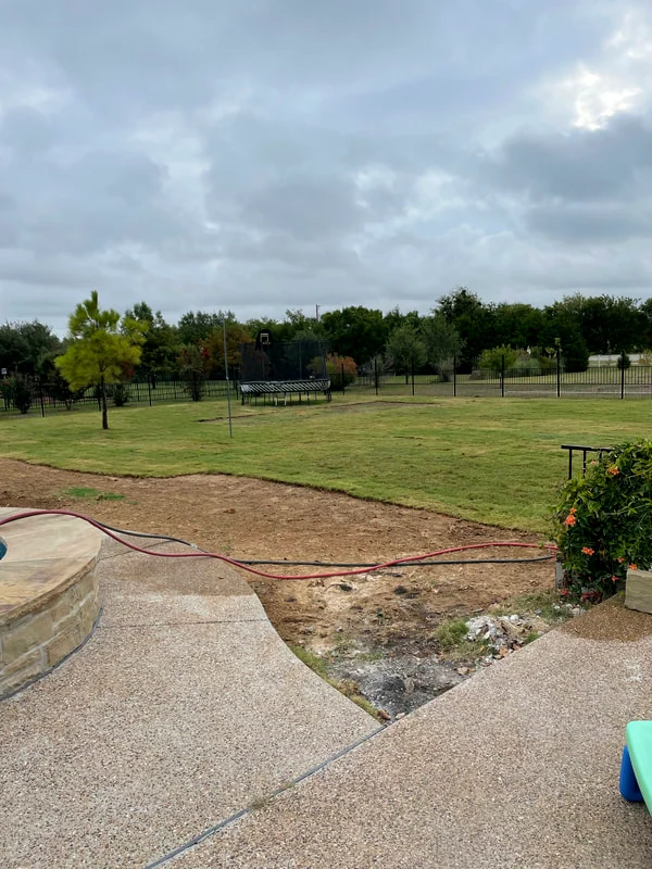 A recently serviced backyard lawn, ready for whatever's next